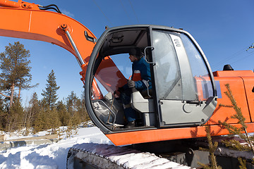 Image showing Excavator with metal tracks running in the woods