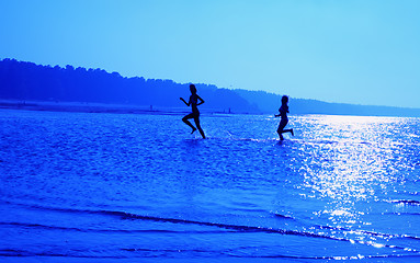 Image showing running girls over blue