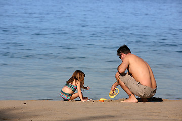 Image showing Father and daughter on the beach