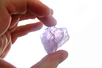 Image showing violet amethyst in the human hand