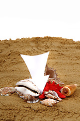 Image showing white arrow in the sand and shells