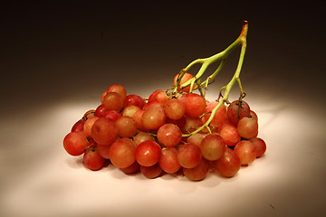 Image showing red grapes in the dark night