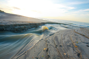 Image showing sand beach and lake in the sunrise