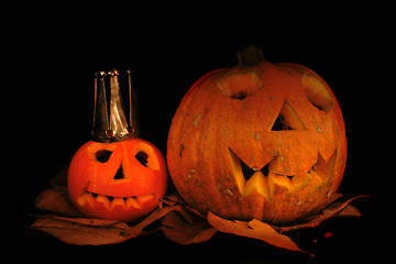 Image showing Halloween pumkins on the black background 