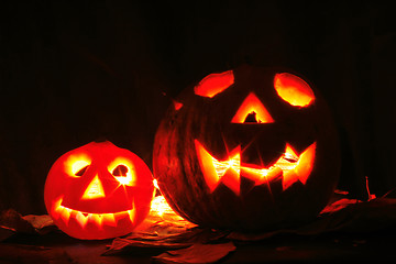 Image showing Halloween pumkins on the black background 