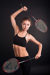 Image showing Beautiful girl with a rackets in hands