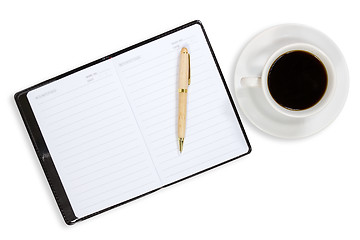 Image showing Notebook and coffee cup