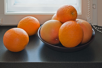 Image showing Oranges on the windowsill.