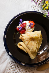 Image showing Pancakes, strawberries and cream