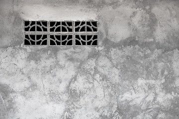 Image showing Gray rough concrete wall with ventilation window