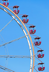 Image showing Ferris wheel with red cabins