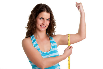 Image showing Sporty Woman Measuring Her Biceps