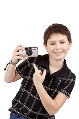 Image showing small boy showing analog camera
