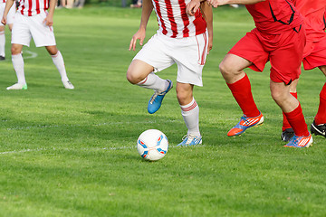 Image showing Soccer player legs dribbling in a match