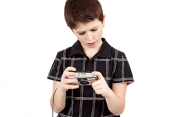 Image showing small boy checking analog camera settings