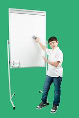 Image showing Portrait of happy little boy showing white blank board