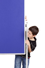 Image showing Portrait of happy little boy with blue blank board