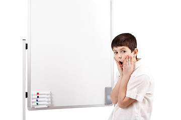 Image showing wonder-struck little boy with white blank board