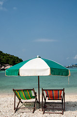 Image showing Two chairs and umbrella on the beach