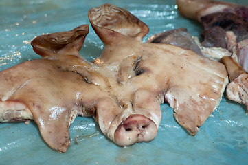 Image showing Pig's head chopped off 