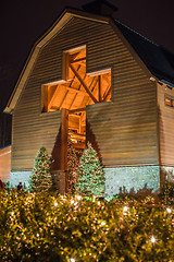 Image showing architectural cross at a village decorated for christmas time