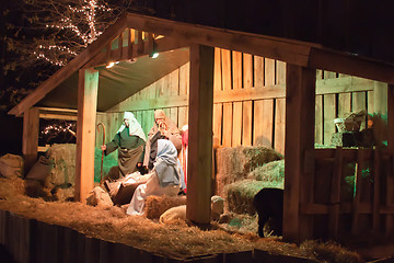 Image showing Live Christmas nativity scene reenacted in a medieval barn