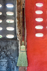 Image showing Broom hanging on the wall ready for cleaning work 