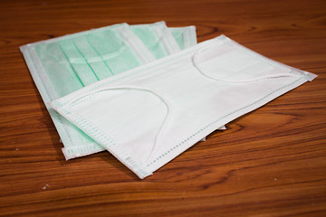 Image showing Medical sanitary mask on wood background