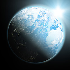 Image showing Sun rising over blue Earth