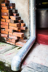 Image showing Old rain gutter with drainpipe inside  residence