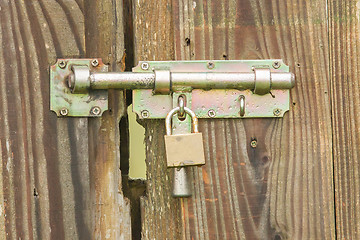 Image showing Wrought iron lock old wooden door