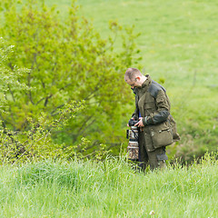 Image showing Wildlife photographer with long telephoto