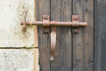 Image showing Wrought iron lock old wooden door