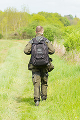 Image showing Wildlife photographer with long telephoto