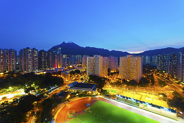 Image showing Hong Kong sunset with crowded buildings background
