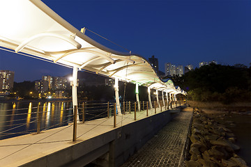 Image showing Footbridge along the coast at night