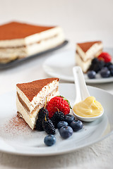 Image showing tiramisu dessert with berries and cream