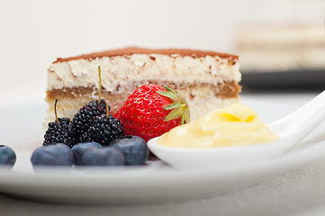 Image showing tiramisu dessert with berries and cream