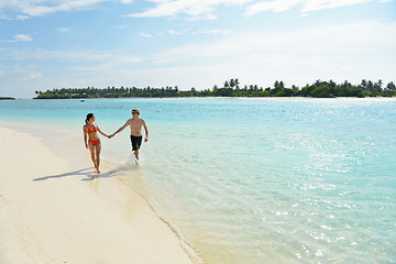 Image showing happy young couple have fun on beach