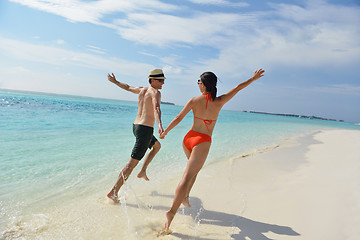 Image showing happy young couple have fun on beach