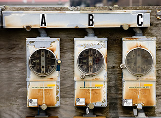 Image showing Three Electric Meters