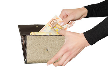 Image showing Isolated purse with bundle of euro money