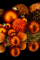 Image showing christmas decoration in orange on black