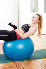 Image showing attractive young woman doing fitness dumbbell