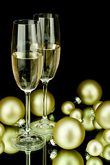 Image showing christmas decoration and champagne on black