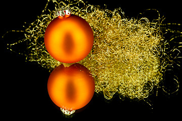 Image showing christmas decoration in orange on black