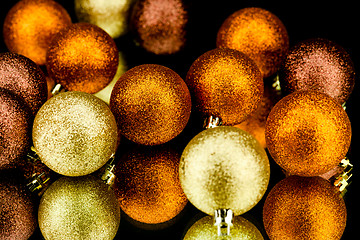 Image showing christmas decoration in orange on black