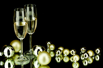 Image showing christmas decoration and champagne on black