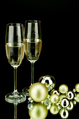 Image showing christmas decoration and champagne on black