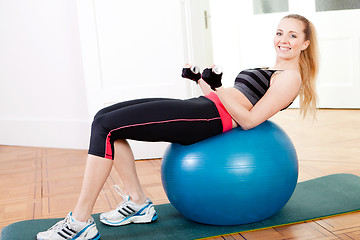 Image showing attractive young woman doing fitness dumbbell